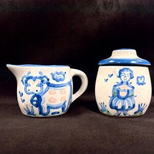 M‎ A Hadley Pottery Sugar and Creamer Set with Cow and Farmer's Wife Designs